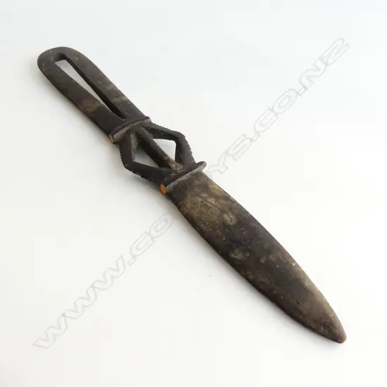 A dark wooden spatula type knife,